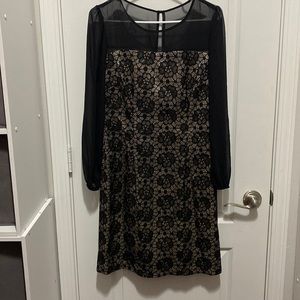 Long sleeve short dress black with floral design with a cream color inside